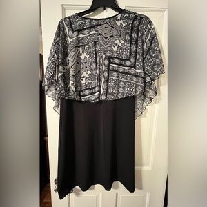 Dress with attached overlay